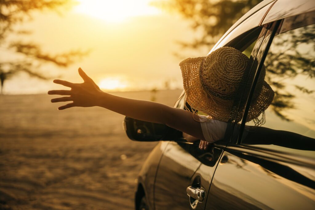 Enjoy Ride Corfu Car Rental woman wearing a stylish hat in a car