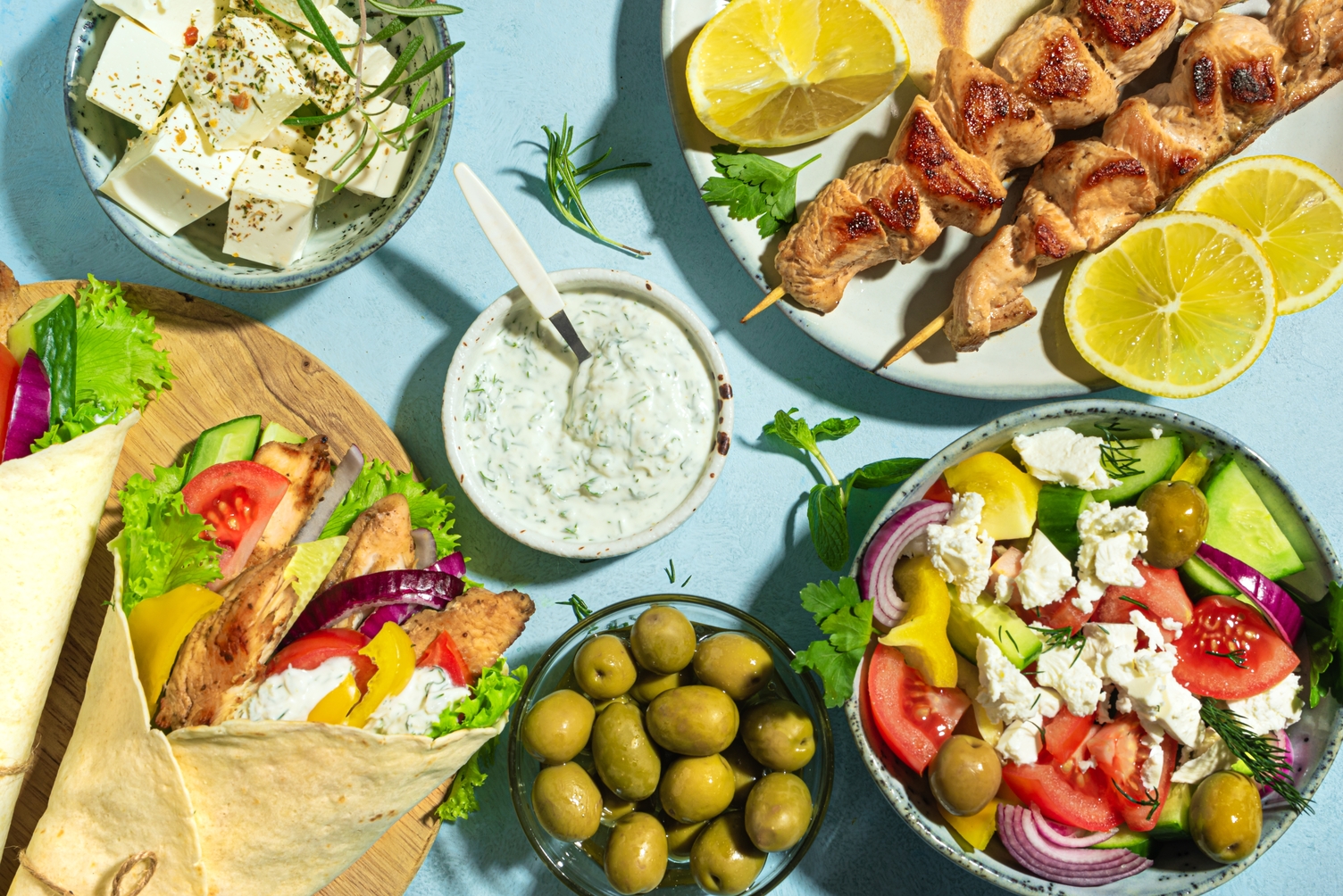 Enjoy Ride Corfu Car Rental table full of food