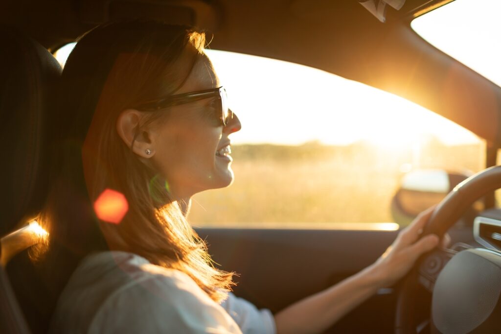Enjoy Ride Corfu Car Rental happy young woman driving